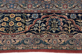 Close-up of paneled floral motifs and blossomed buds on the vintage Bulgarian carpet.