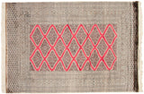 Detailed corner of a Turkmen rug with intricate geometric borders and intact side cord selvage.