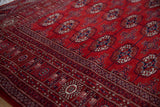 Plush, silk-like cherry red pile and fine weave of a vintage Bokhara rug.