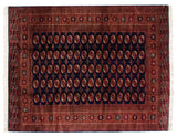Vintage fine Bokhara carpet with repeating rust and ivory gul medallions on a navy blue field.