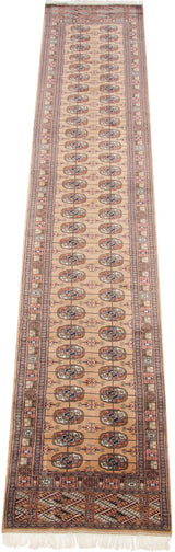 Fine weave, plush pile, and camel field with multi-color geometric gul medallions.