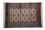 Vintage Pakistani Turkmen design rug with diamond gul medallions in sky blue and mauve on a golden field.