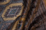 Plush pile of a vintage Turkmen rug showing a detailed gul medallion and intricate borders.
