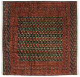 Vintage Bokhara square carpet with repeating gul medallions on an emerald green and rust-red field.