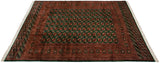Lustrous wool pile of a fine Bokhara carpet with repeating emerald green and rust gul medallions.