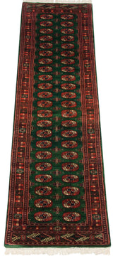 Columns of repeating gul medallions on the lustrous emerald green field of a vintage Bokhara runner.