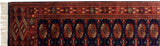 Plush vintage Bokhara rug with fine weave navy, rust, and ivory gul medallions.