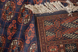Fine hand-knotted construction of a Bokhara runner showing the tight weave and plush navy pile.