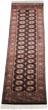Plush, silk-like pile and detailed Bokhara gul medallions in black, terra cotta, ivory.