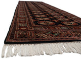 Cream fringe and intricate geometric border on a hand-knotted Vintage Bokhara runner.