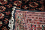 Tight hand-knotted foundation of a vintage Bokhara carpet shown with its plush wool pile.