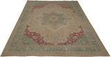 Angled perspective of a vintage Kerman design rug showing its starburst medallion and distressed color palette.