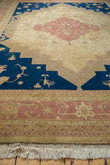 Dusty rose Samovar stylized border, geometric stepped contour, navy field, and ivory fringe.