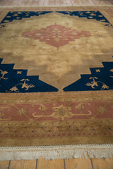 Dusty rose meandering Samovar border and ivory fringe detail of a vintage Indian Serapi rug.
