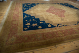 Dusty blush and beige Serapi rug border with meandering vine and Samovar motifs.