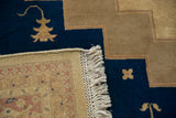 Beige fringe and intricate geometric border detail of the hand-knotted Indian Serapi rug.