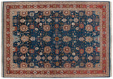 Ornate floral palmettes and vinery in brick red and beige on a sky blue field.