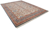 Angled view of a vintage Indian Sultanabad carpet showcasing its full floral and palmette design.