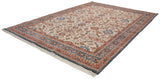 Vintage Sultanabad carpet from a diagonal angle, showing its ivory field with floral palmettes and blue border.