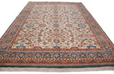 Angled perspective of a vintage Sultanabad carpet showing its allover floral and palmette design.