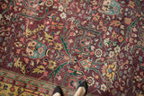 Vintage Indian Bijar rug's plush pile, burgundy field, and gul ferang rose floral motif.