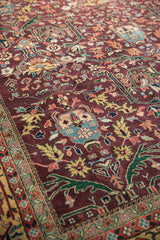 Vintage Indian Bijar rug, plum field, scrolling gul ferang motifs, and vine border.
