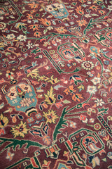 Indian Bijar carpet detail: rich plum field with varied green and gold gul ferang motif.