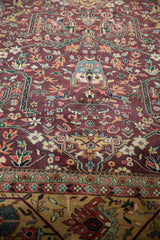 Vintage Indian Bijar rug border with emerald green, ivory, and burgundy floral patterns.