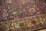 Indian Bijar rug's burgundy field with rose florals and pale gold meandering vine border.