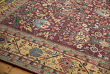 Vintage Indian Bijar design carpet detail, showing gul ferang motif on burgundy field and beige vine border.