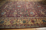 Burgundy gul ferang motif on a vintage Indian Bijar rug with golden meandering vine border.