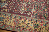 Indian Bijar carpet close-up: gul ferang motif on burgundy, pale dusty gold meandering vine border.