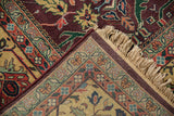 Vintage Indian Bijar rug corner, showing plum gul ferang motif, colorful vine border, and fringe.