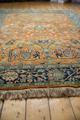 Orange rust Indian Bijar design carpet with gul ferang florals, navy vine border, and full pile.