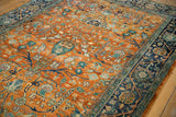 Orange rust field with scrolling rose floral motifs on the Indian Bijar vintage carpet.
