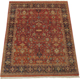 Vintage Indian Mahal rug from an angle, highlighting the terra cotta field and intricate turtle motifs.