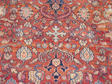 Close-up of the vintage Mahal rug's turtle and Samovar motifs on a terra cotta field.