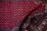 The original full pile and intricate hand-knotted botehs of a vintage Tajabad runner rug.