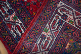 Original red side cord selvage on a vintage Tajabad runner with an intricate wave border.