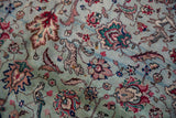 Detailed view of pictorial leopard and palmette motifs on a plush, vintage Tabriz rug.