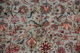 Detail of the full, plush pile of a vintage Tabriz, showing a small noted condition spot.