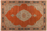 Vintage Tabriz design carpet with an orange medallion field, silver floral corners, and a dark navy border.