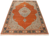 Angled view of the vintage Tabriz design carpet highlighting the grand scale of its central medallion on a burnt orange field.