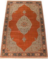 Expansive vintage Bulgarian Tabriz carpet with a burnt orange field and intricate silver floral medallion.