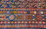 Paneled cartouches with animal motifs and geometric designs in this antique Afshar carpet's border.