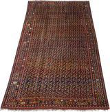 Angled perspective of a grand antique Afshar carpet revealing its immense scale and dense boteh field.