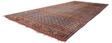Long perspective view of an antique Persian Afshar carpet, emphasizing its scale and dense boteh pattern.