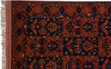Corner view of a vintage Taghan rug with its intact side cord selvage and full pile.