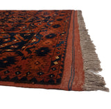 The original side cord selvage and plush, hand-knotted pile of a vintage Taghan rug corner.