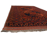 Intact side cord selvage and fringe of the vintage Pakistani Ersari rug.